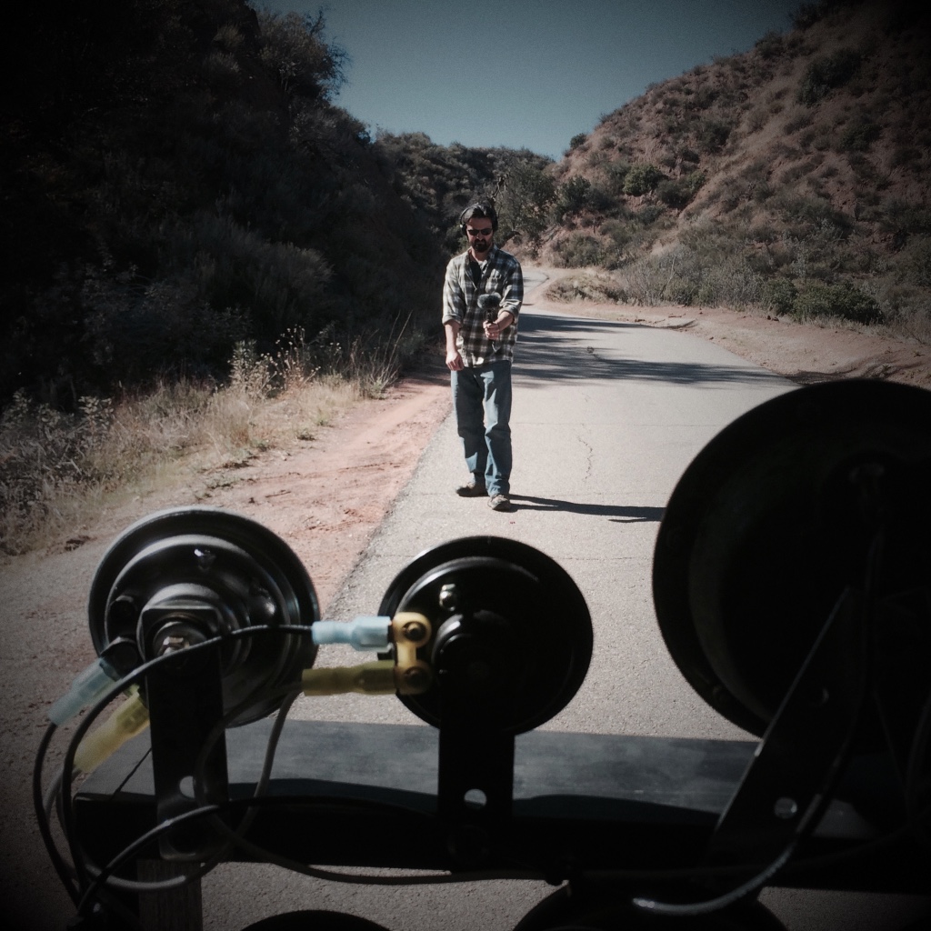 Sound artist records car horn mechanism on a remote road.