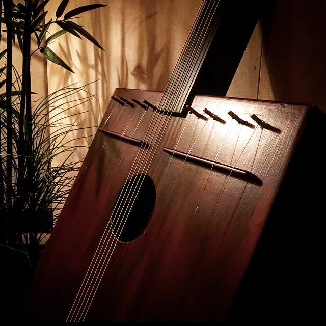 Handcrafted wooden conjoined stringed instrument designed for experimental soundmaking.