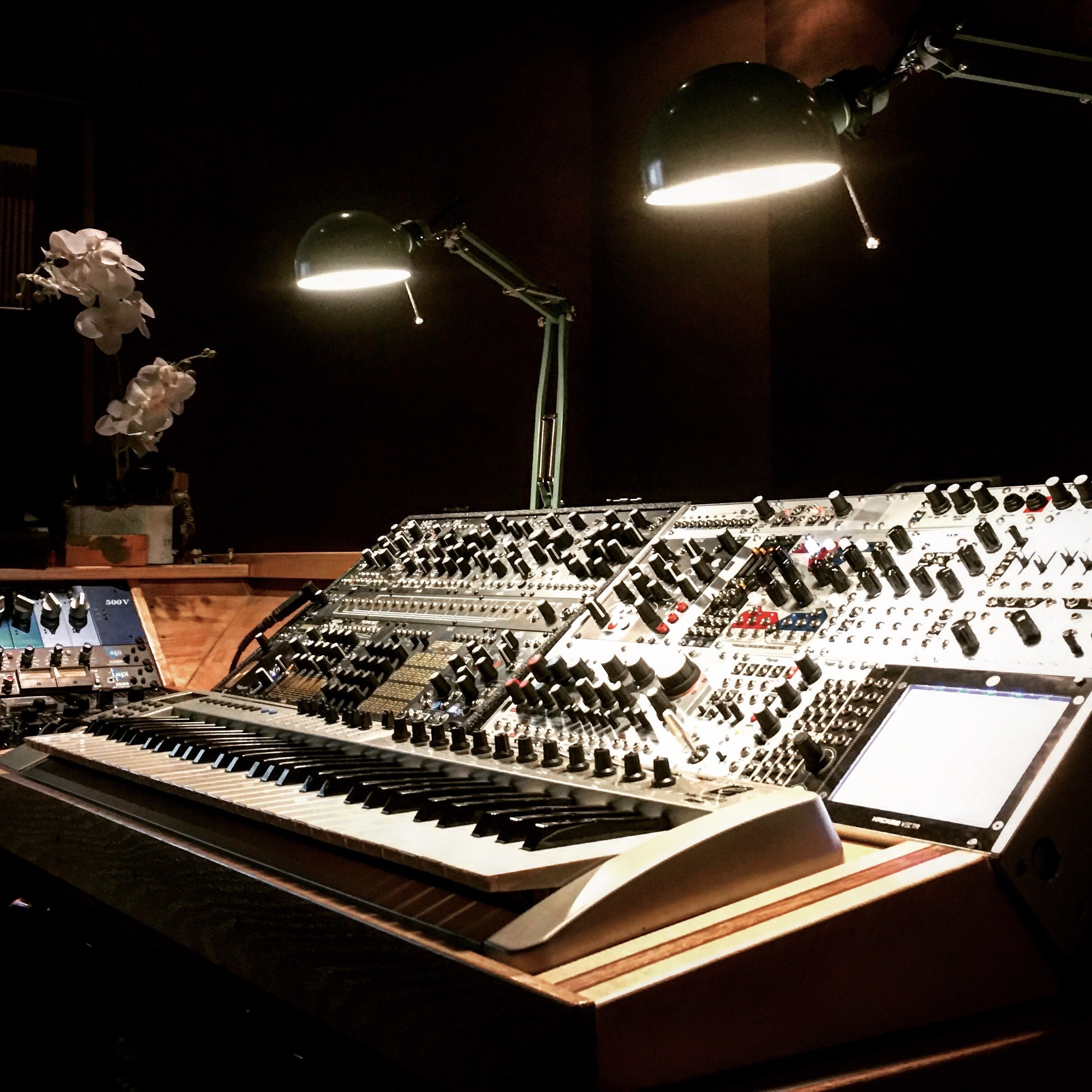 Modular synthesizer and keyboard setup on a workbench in the Sound Sculpture studio